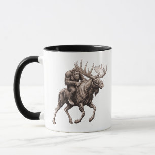 Taza Pie Grande montando alce 