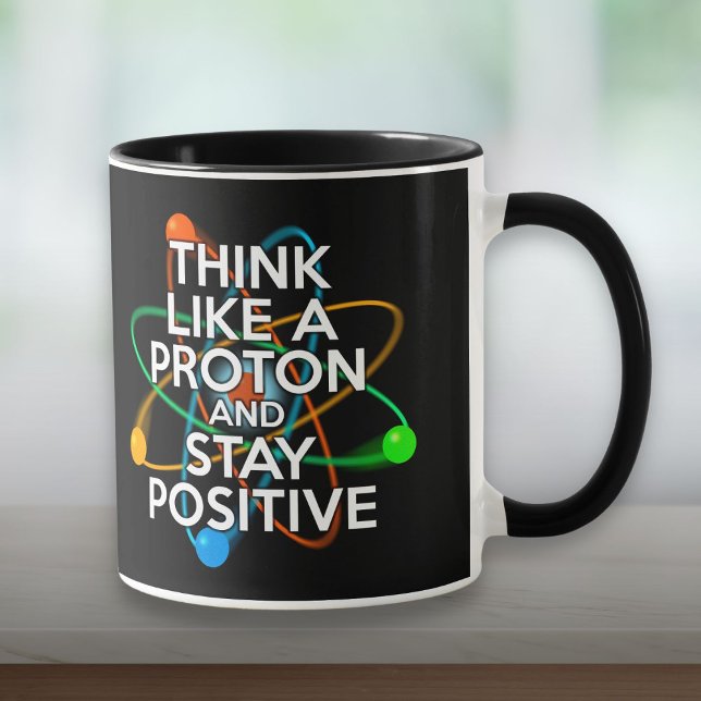 TAZA PIENSA COMO UNA PROTONIA Y MANTÉNGASE POSITIVO (THINK LIKE A PROTON AND STAY POSITIVE MUG)