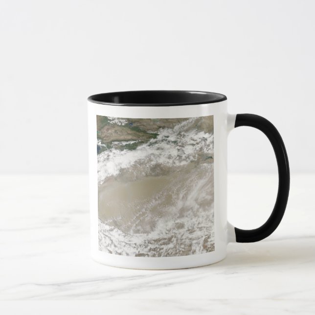 Taza Polvo y nubes sobrevuelan el Des Taklimakan (Derecha)