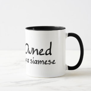 Taza poseído por un siamés