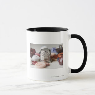 Taza Primer de botones con un casquillo metalizado