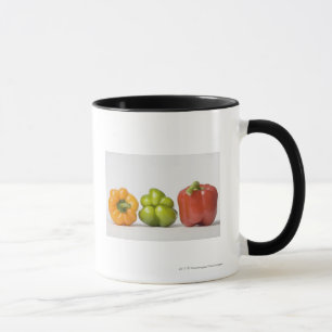 Taza Primer de los paprikas en una fila