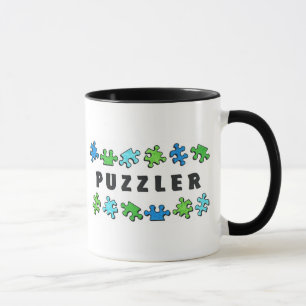 Taza Puzzler con los pedazos del rompecabezas