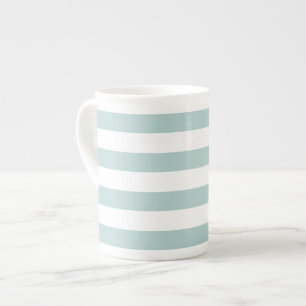 Taza rayada de la porcelana de hueso