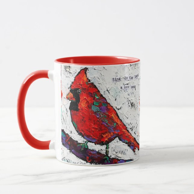 Taza roja de la escritura del pájaro (Izquierda)