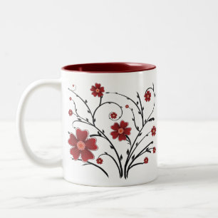 Taza roja de las flores