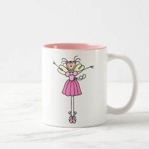 Taza rosada bonita de la bailarina del ángel