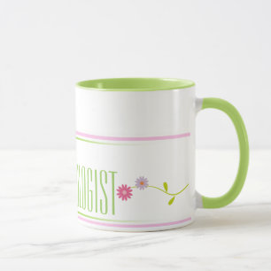 Taza rosada y verde del psicólogo de la escuela de