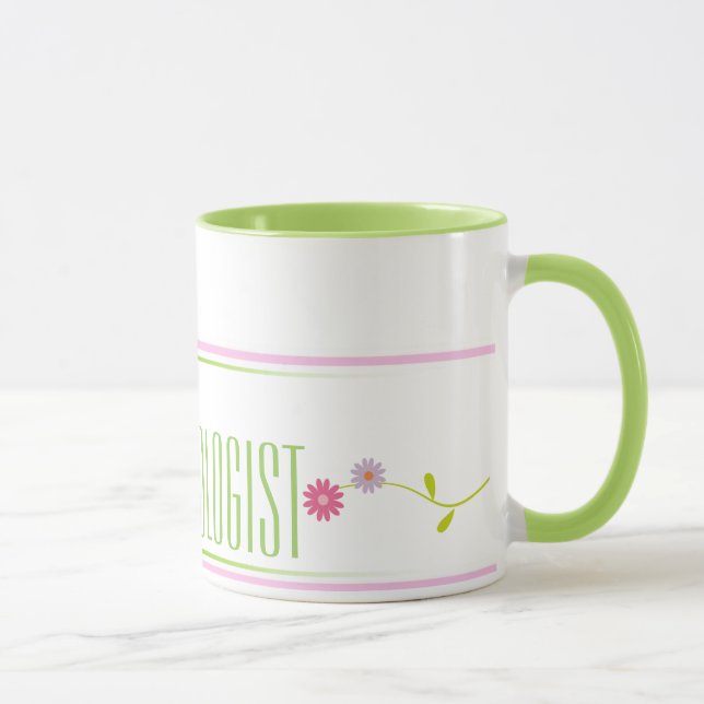Taza rosada y verde del psicólogo de la escuela de (Derecha)