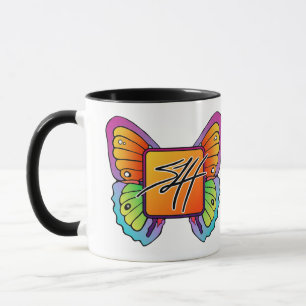 Taza SLH con el logotipo de las alas de mariposa