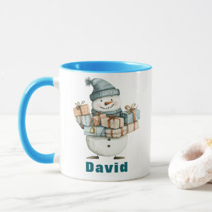 Taza Snowman sosteniendo Navidad presenta al Gorra azul