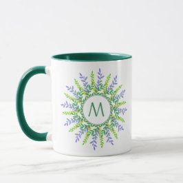 Taza Su monograma en un marco foliar