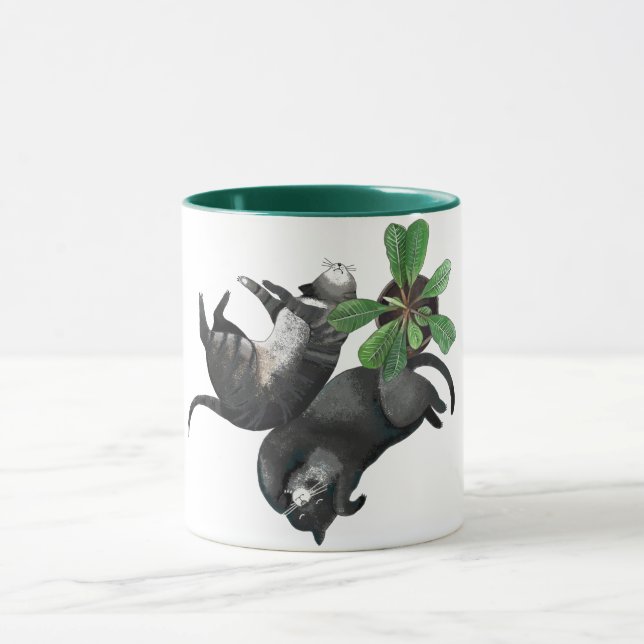 Taza Taza| Dos gatos yacen con una planta (Centro)