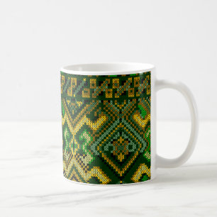 Taza ucraniana del modelo de la puntada de la cruz