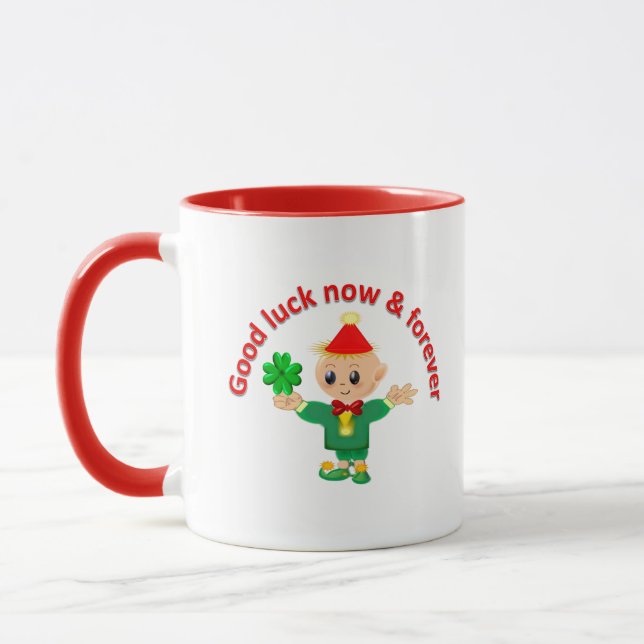 Taza Un elfo verde suave sosteniendo un shamrock (Izquierda)