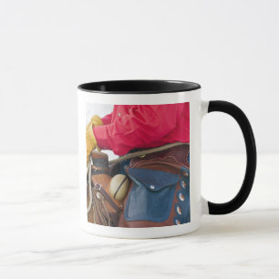 Taza Vaquero en grietas del cuero del caballo que
