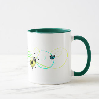 Taza verde de las mariquitas