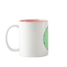 Taza verde del buñuelo