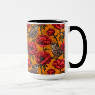 Taza Wrens en un jardín anemónico rojo