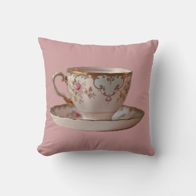 Taza y platillo de té rosado con la almohada de (Anverso)