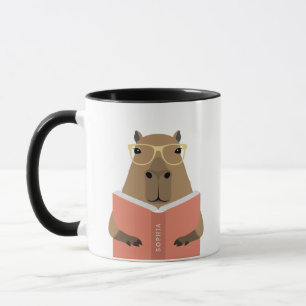Tazas de capibara leyendo