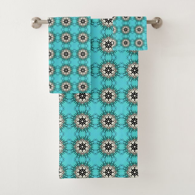  teal towels featuring a black and white geometric (In situ)