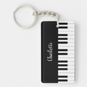 Teclado de piano, llavero blanco y negro del
