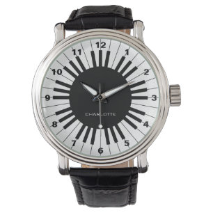 Teclado de piano, reloj negro y blanco