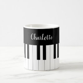Teclado de piano, taza blanco y negro
