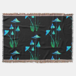 Tejida Setas que brillan intensamente en la manta oscura