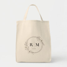 Bolso de mano con monograma floral elegante person