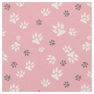 Tela  Huellas de perro en un fondo rosado