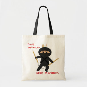Tela Ninja con el bolso circular de las agujas que