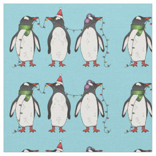 Tela Tres pingüinos navideños festivos sobre azul claro