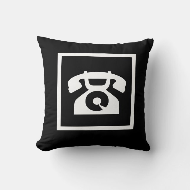teléfono blanco retro en almohada negra (Anverso)