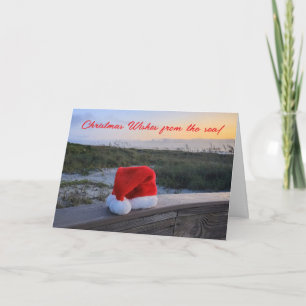 Tema de playa Tarjeta de vacaciones con Santa Hat