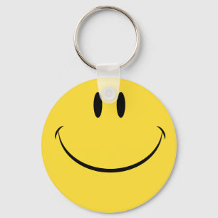 Tenga un llavero feliz retro de la cara del día