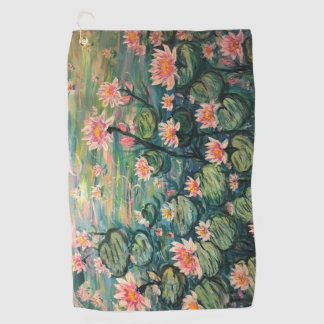 Tenis y toalla de golf