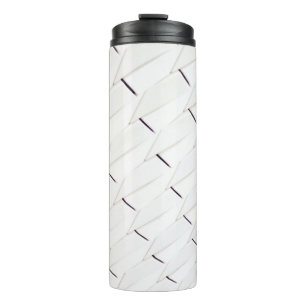 Termo A pattern of white geometric shapes in a facade