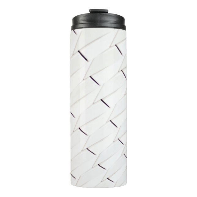 Termo A pattern of white geometric shapes in a facade (Anverso)