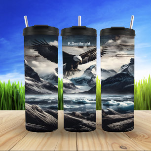 Termo Águila calva sobre picos congelados