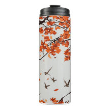 Árbol de otoño con hojas y pájaros.