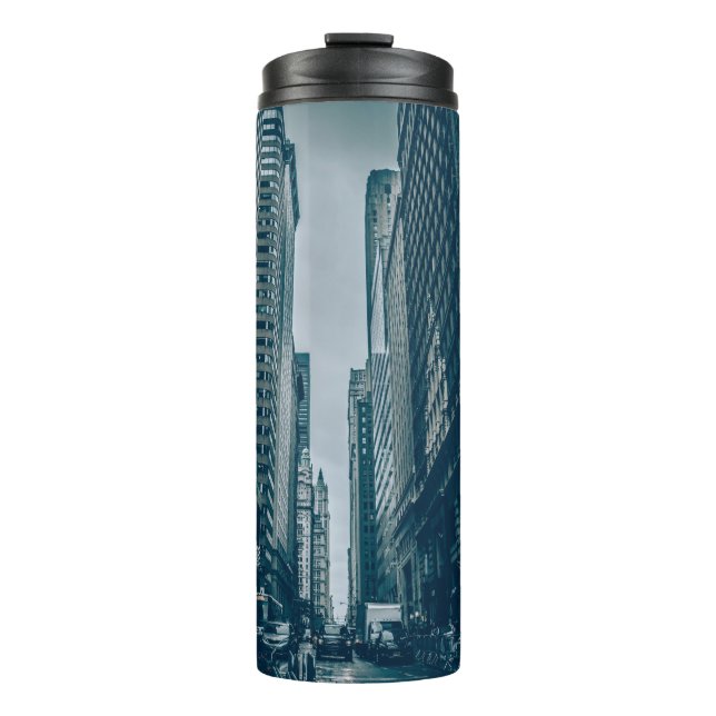 TERMO AUTOS DE CARRETERA ENTRE EDIFICIOS EN LA FOTOGRAFÍ (Anverso)