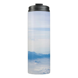 Termo Blue sky and mountains view from airplane stylized