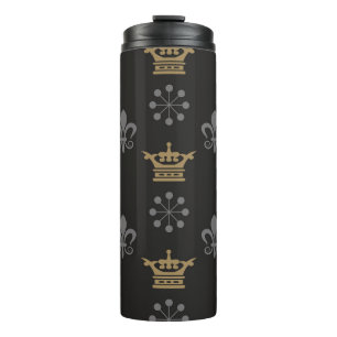 Termo Crownes dorados sobre fondo de escritorio negro, p