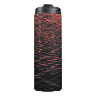 Termo Cuerpo de agua durante la puesta de sol