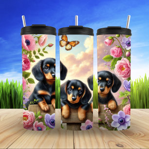 Termo Dachshunds en un jardín de primavera