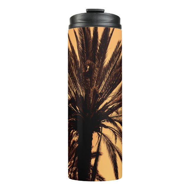 Termo Dark silhouettes of date palms against bright colo (Anverso)