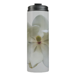 Termo Flor de magnolia blanca en un tumblador térmico