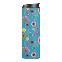 Flores praderas en el tumbler termal azul